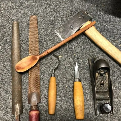 Round wood badge bit in progress